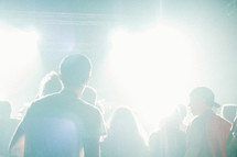 teens in an audience at a concert 