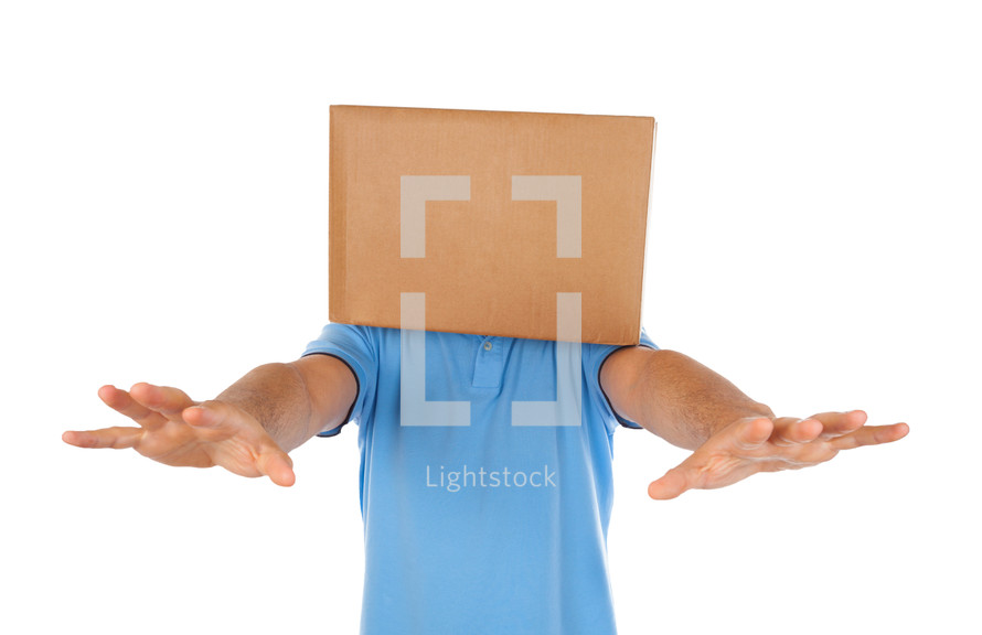 Young man standing with a cardboard box on his head 