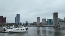 Drone footage of a harbor looking into downtown Baltimore, Maryland.