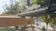 Close up of a jig saw cutting through wood in slow motion