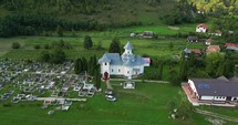 Panoramic Aerial View Of An Ancient Church And Cemetery In Palanca, Bacau County, Western Moldavia, Romania.