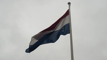 National Flag Of The Netherlands In The Capital City Of Amsterdam. Slow Motion Shot