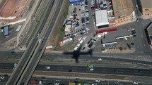 Shadow of an airplane over a city