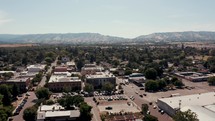 The view above a historic downtown with mountains in the background
