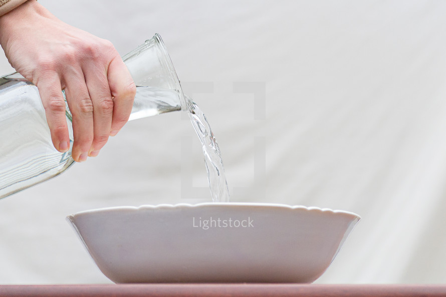pouring water in a bowl 