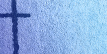 Blue cross on the left with textured light blue background