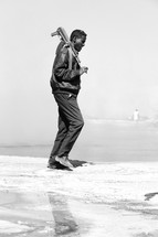 man policing the area near a salt lake in Ethiopia 
