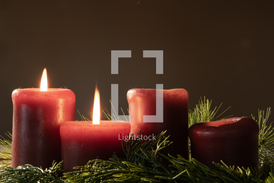 Lit advent candles in garland