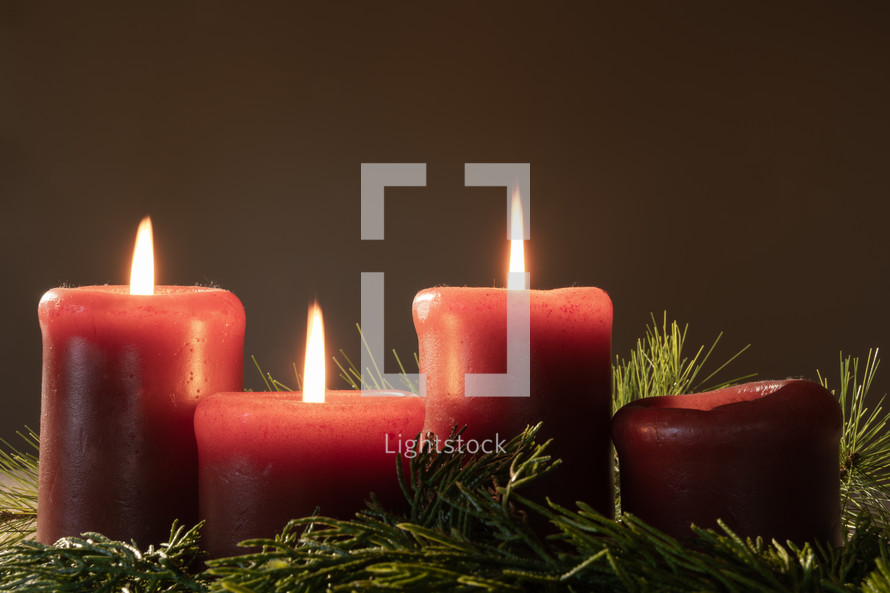 Lit advent candles in garland