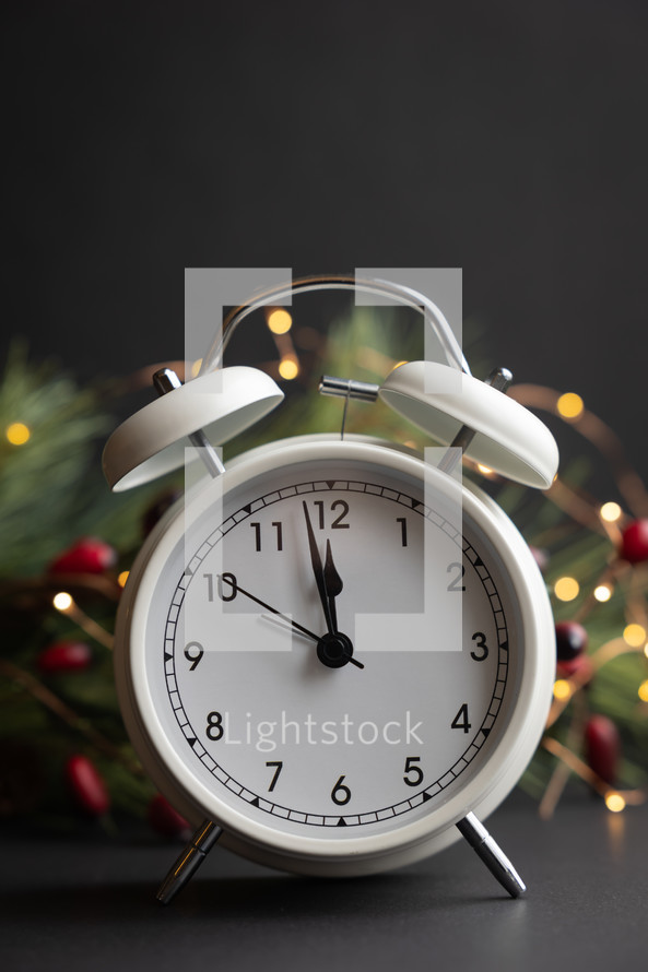 alarm clock and Christmas garland 