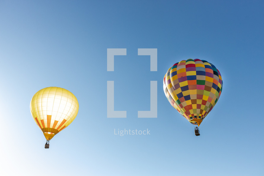hot air balloons in a blue sky 