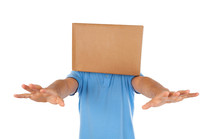 Young man standing with a cardboard box on his head 