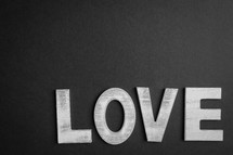 Black background with the word love