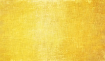 golden yellow woven fiber / fabric background with glow and distressed texture