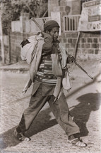 man walking carrying clothes in Ethiopia 