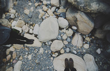 feet standing on rocks 