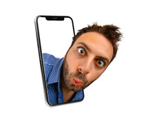 Man's face jumping out of phone on a white background