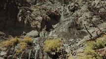 trickling water off the side of a cliff 