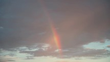 Rainbow In The Sky At Sunrise