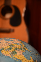guitar and world globe 