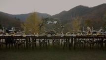 Dinner Table for a Wedding Reception with Mountains as the Backdrop in Fall