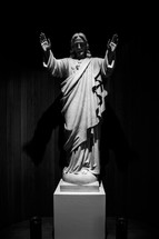 statue of Jesus with hands raised 