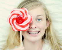 Teenager holding lollypop