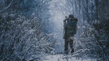 Hunter In The Forest During A Blizzard