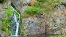 waterfall on a rock cliff face 