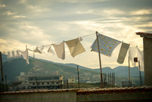 Laundry hanging on a clothesline blowing in the wind.