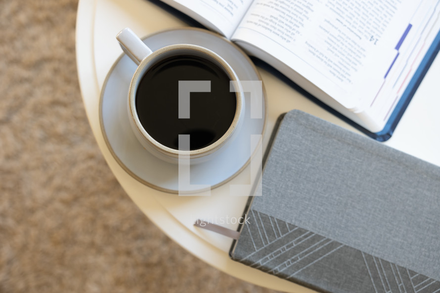 coffee table with Bible, coffee cup, and journal 
