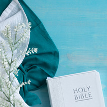 white bible and linen on blue with Bible 