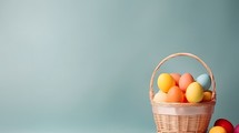 Easter eggs in a basket with copy space