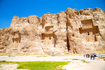 ruins of buildings built into cliffs in Iran 