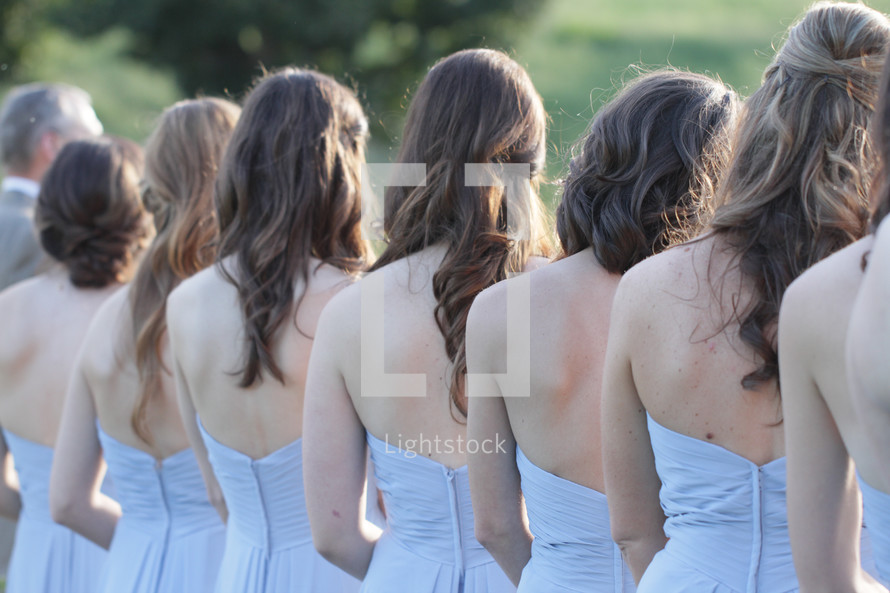 backs of bridesmaids 