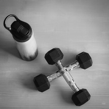 water bottle and gym weights 