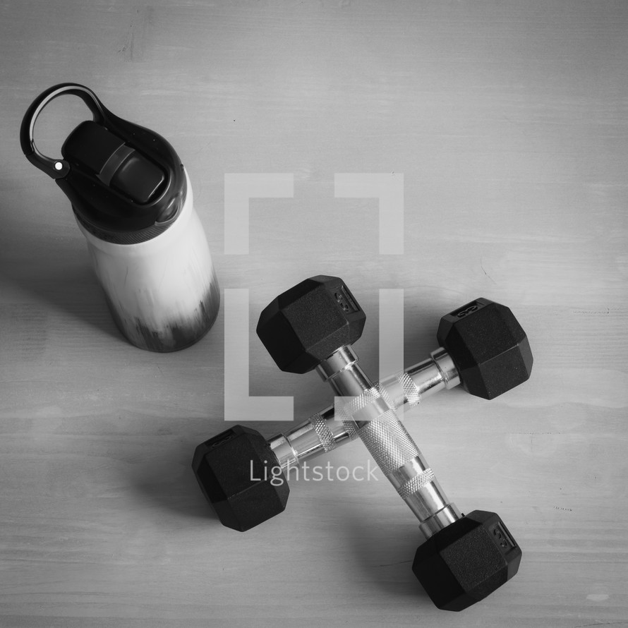 water bottle and gym weights 