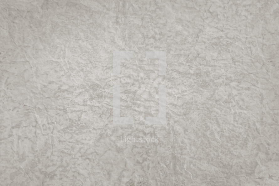 neutral backdrop of all-over textured surface in low contrast
