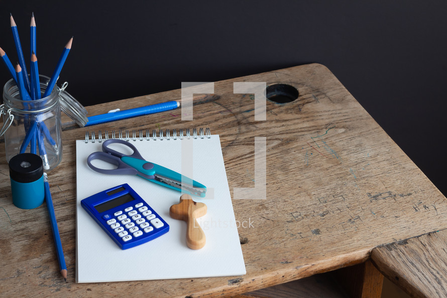 school supplies on a student desk 
