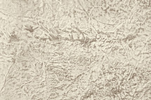 cream and brown textured surface in low relief