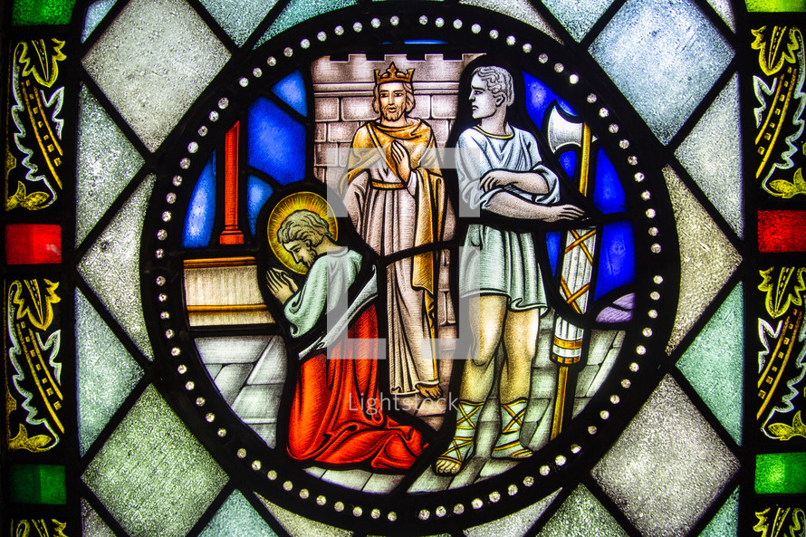stained glass window  of Jesus praying 