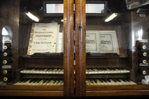 organ behind glass doors 