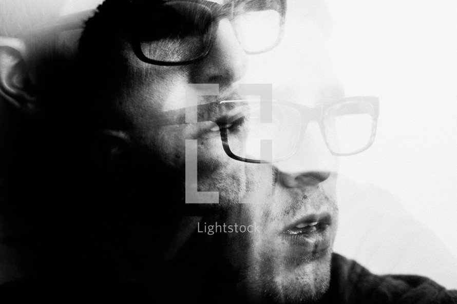 double exposure face of a man in glasses 