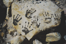 handprints on rock 