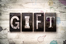word gift on wood background 
