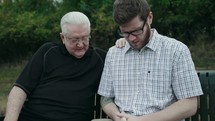 older man mentoring a young man 