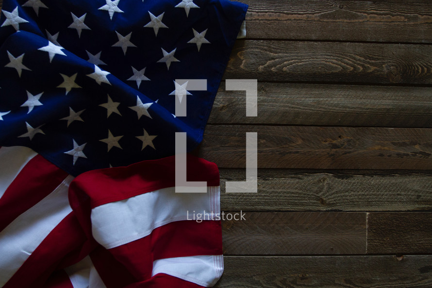 American flag lying on wood 
