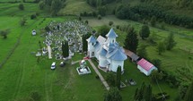 Roman Catholic Church And Cemetery In Palanca, Bacau County, Western Moldavia, Romania. Aerial Drone Shot