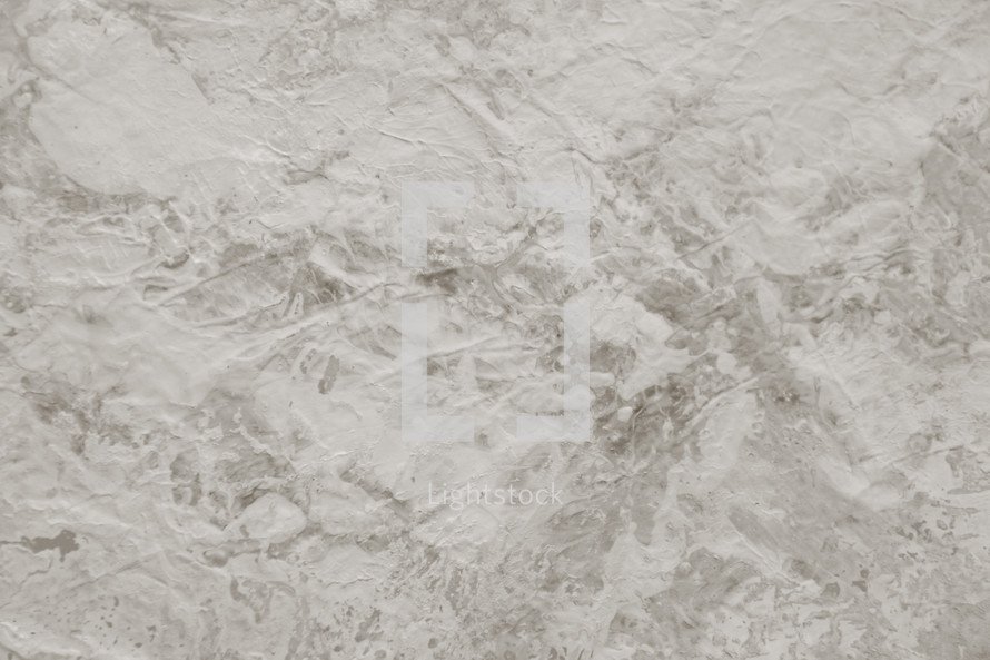 painted textural surface in neutral tones and low contrast