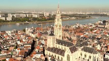 Cathedral of Our Lady amid Antwerp cityscape and Scheldt river, Belgium - Aerial wide Panoramic shot